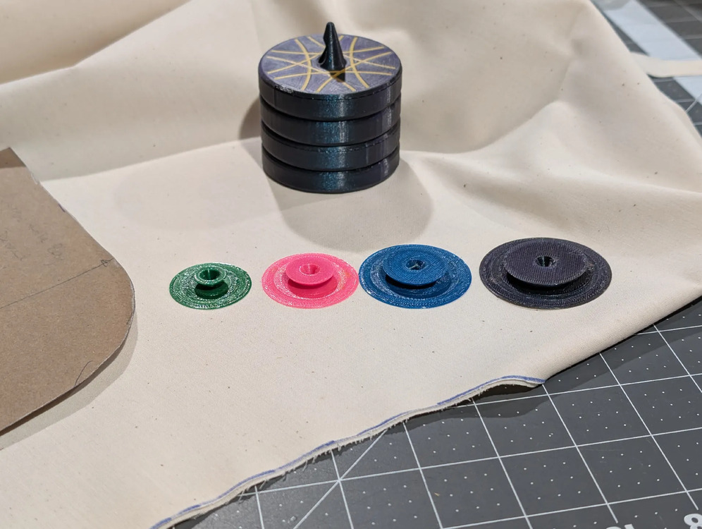 Seam allowance discs in a range of colors on a cutting mat