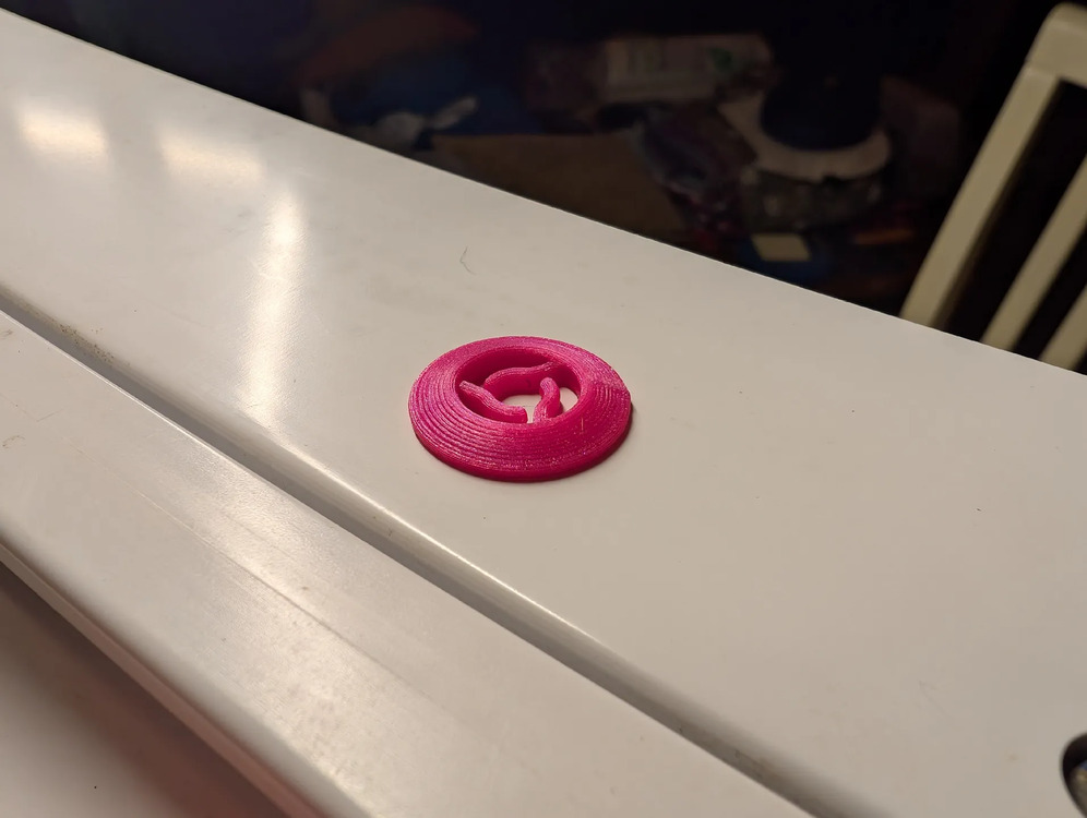 Spool pin cap, angled view