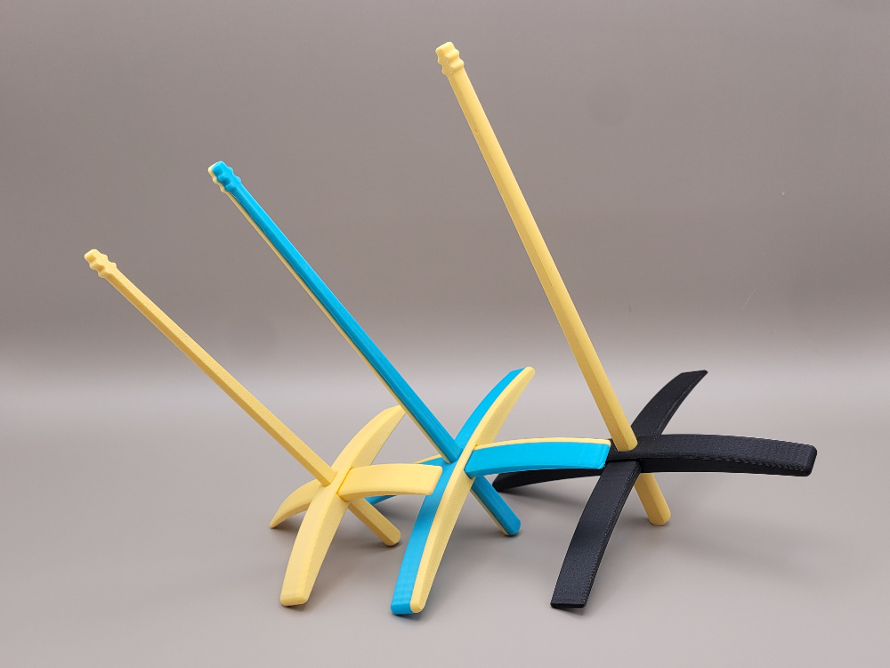 Three sizes of drop spindle